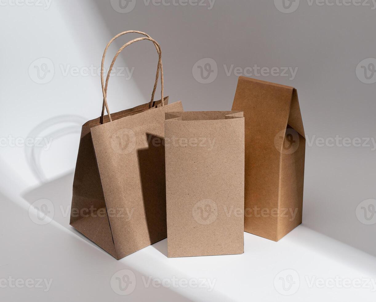 Kraft paper bag, pouch, sack, box. Brown beige eco package, packs for product, gifts photo