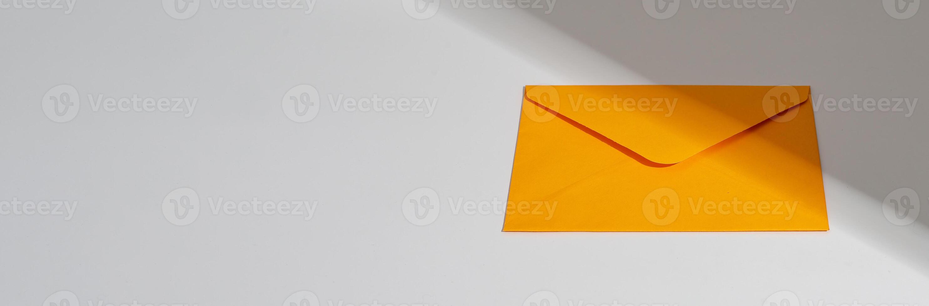 Orange envelope, paper letter, mail, post. Banner background, copy space for text photo