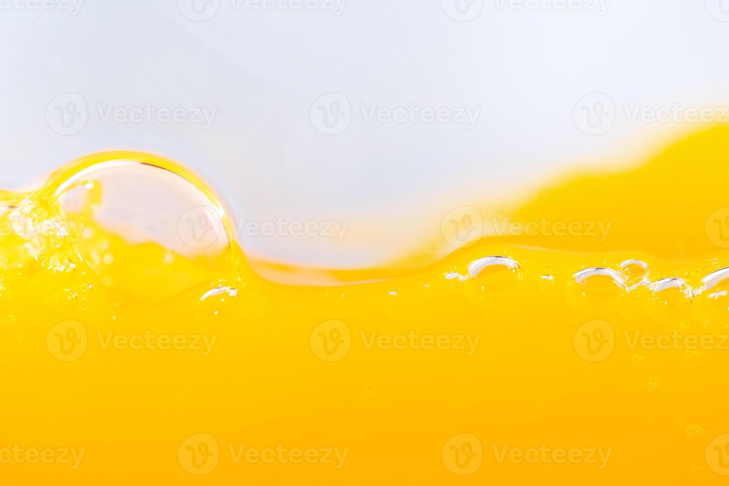 Close up bright orange juice splash texture for health and nature waves, Beautiful waves curve and little bubbles smooth for garphic design and background photo