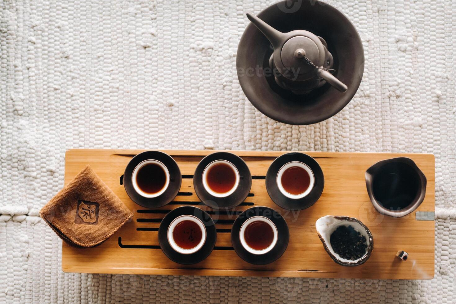 Preparing for a tea ceremony with a large company photo
