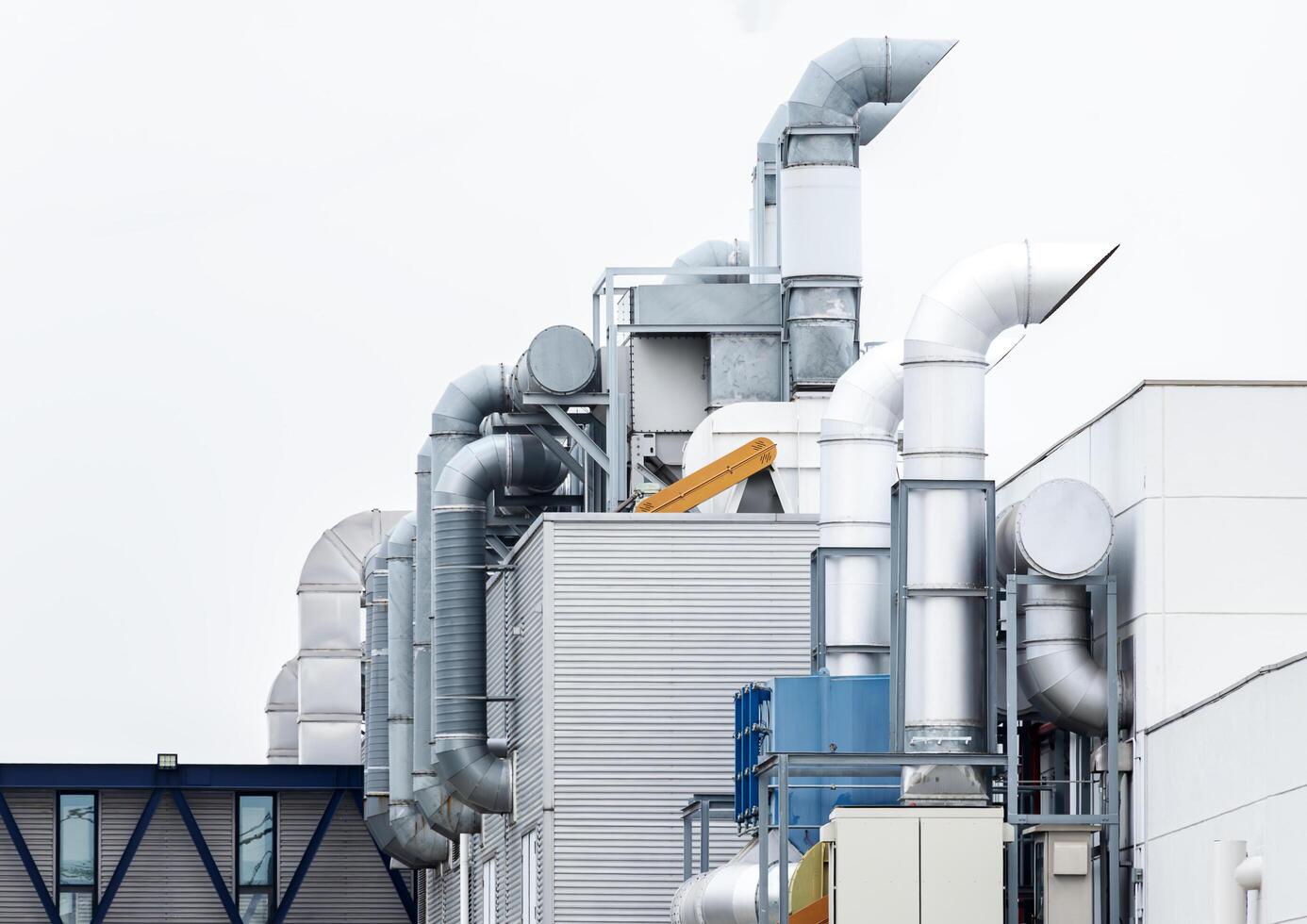 Chimney ventilation system on outside industry building photo