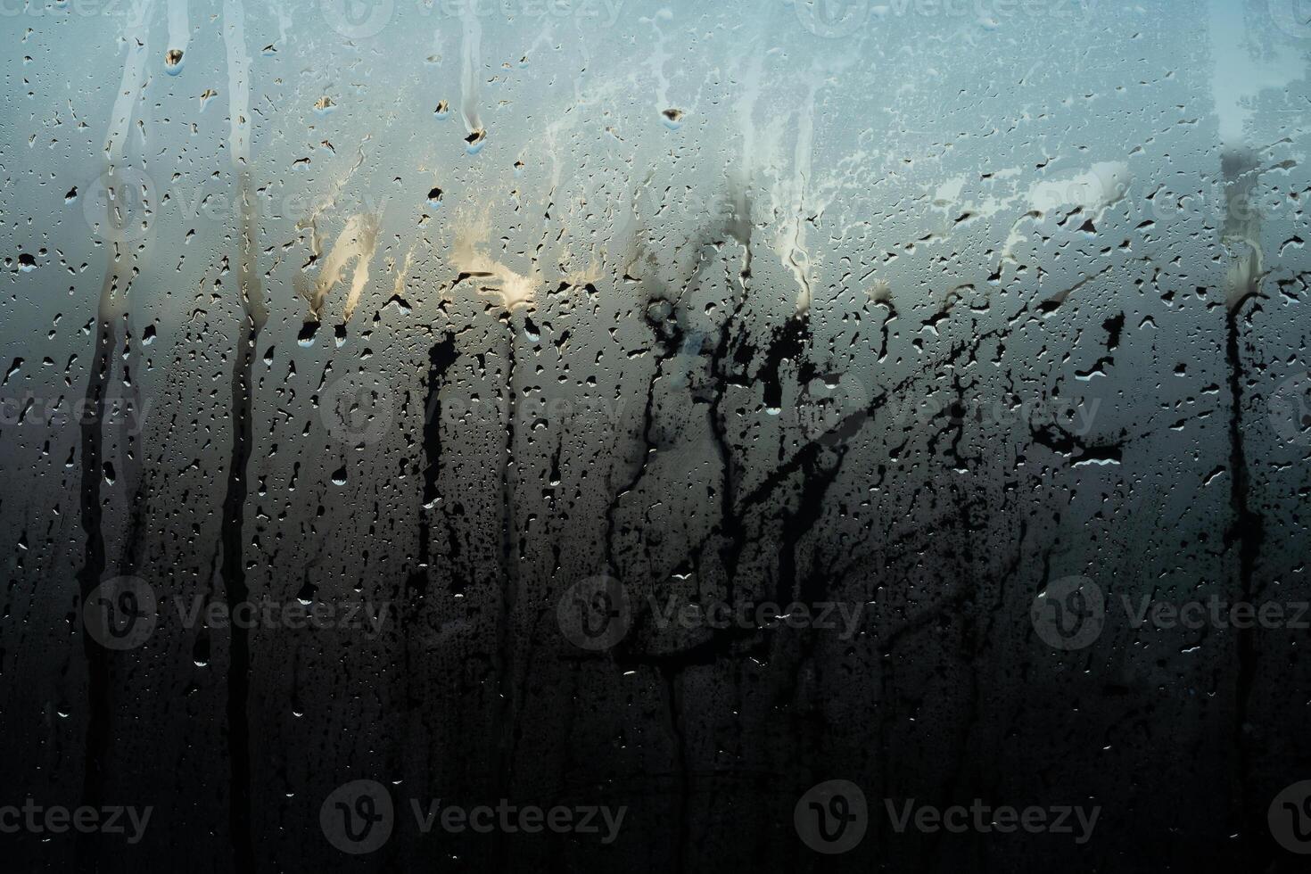 Window Rain, raindrops creating a beautiful, textured surface on a clear window texture background photo
