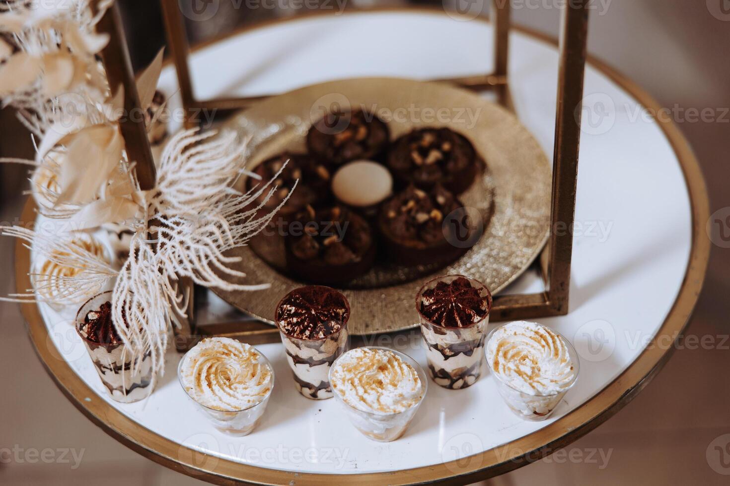 Almond cookies, sweet cakes for a wedding banquet. A delicious reception, a luxurious ceremony. Table with sweets and desserts. Delicious colorful French desserts on a plate or table. Candy bar. photo