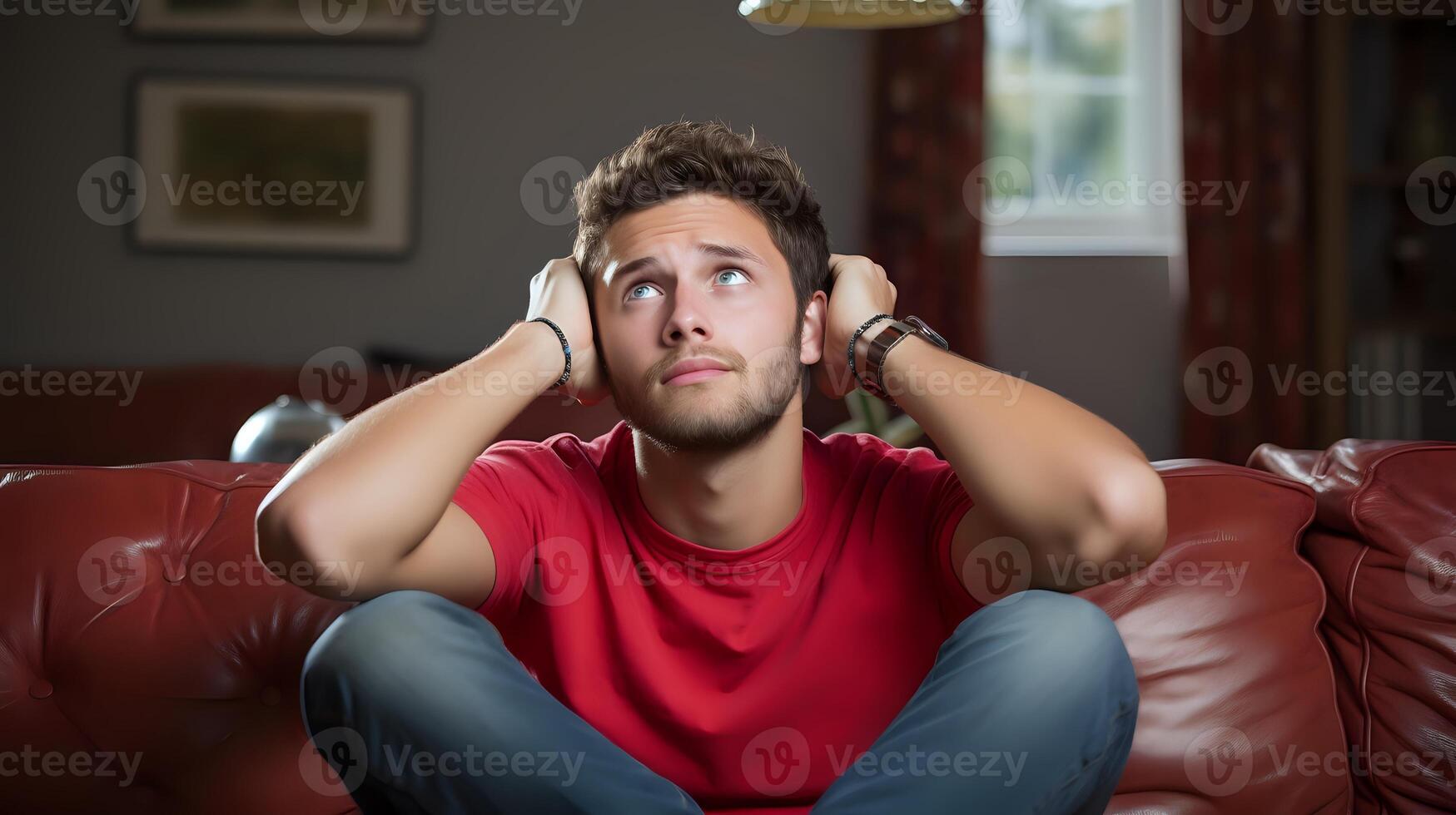 AI generated A young man sits on a couch with his hands over his ears, looki photo