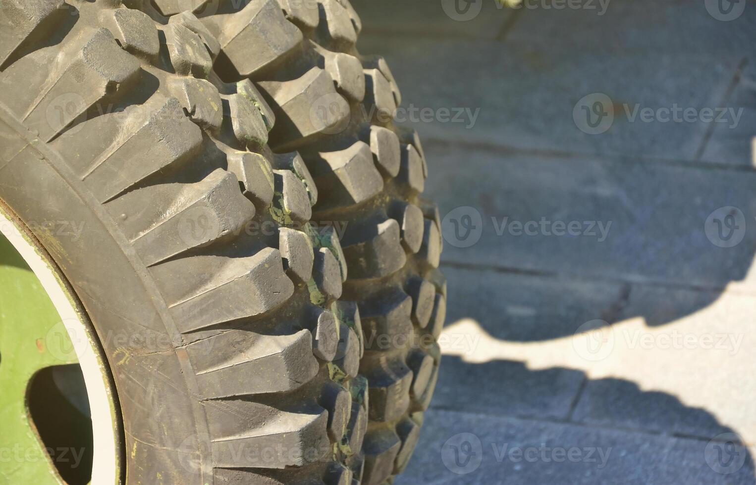 A close-up wheels of a portable weapon of the Soviet Union of World War II, painted in a dark green photo