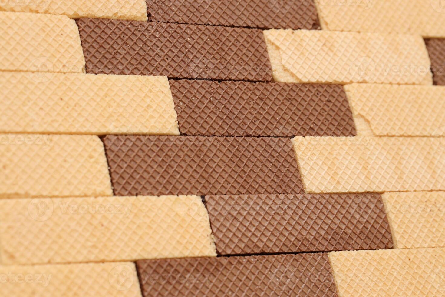 Stacked delicious chocolate wafers in large amount. Two different flavours of classic waffles photo