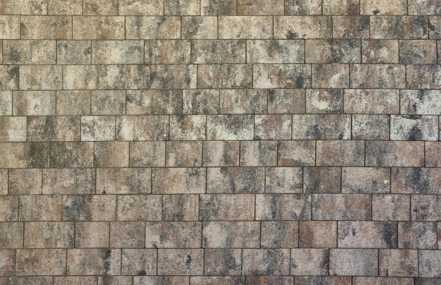 Marble tiles on brick floor or wall background with grey and brown colors front or top view photo