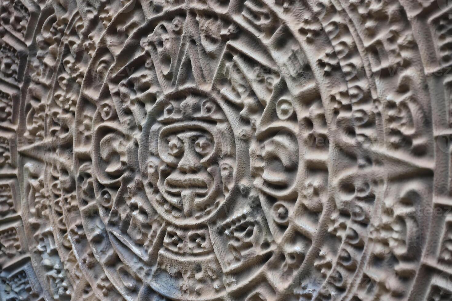 Ancient Mayan Calendar or Aztec calendar with rough relief surface photo