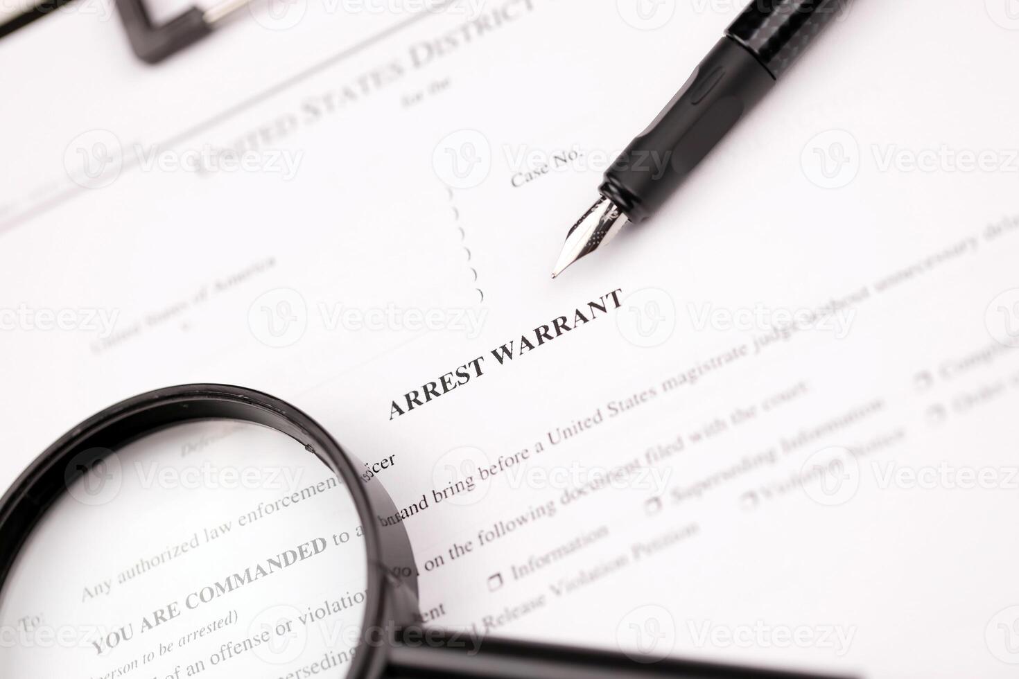 District Court Arrest Warrant court papers on A4 tablet lies on office