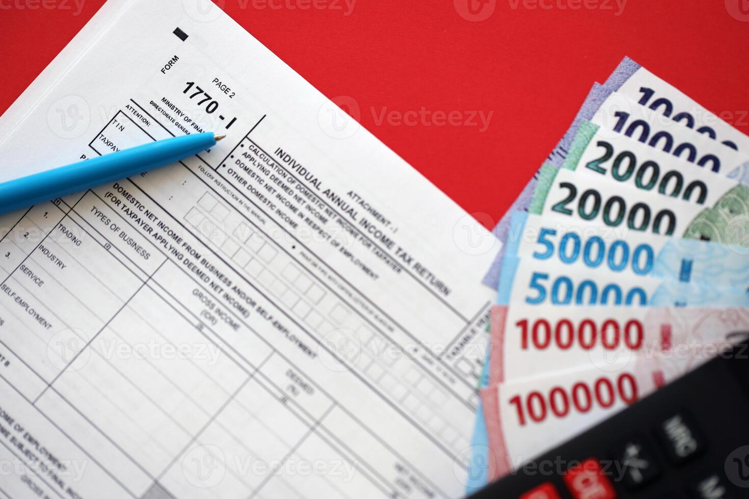 Indonesian tax form 1770-1 Individual Income Tax Return and pen on table photo