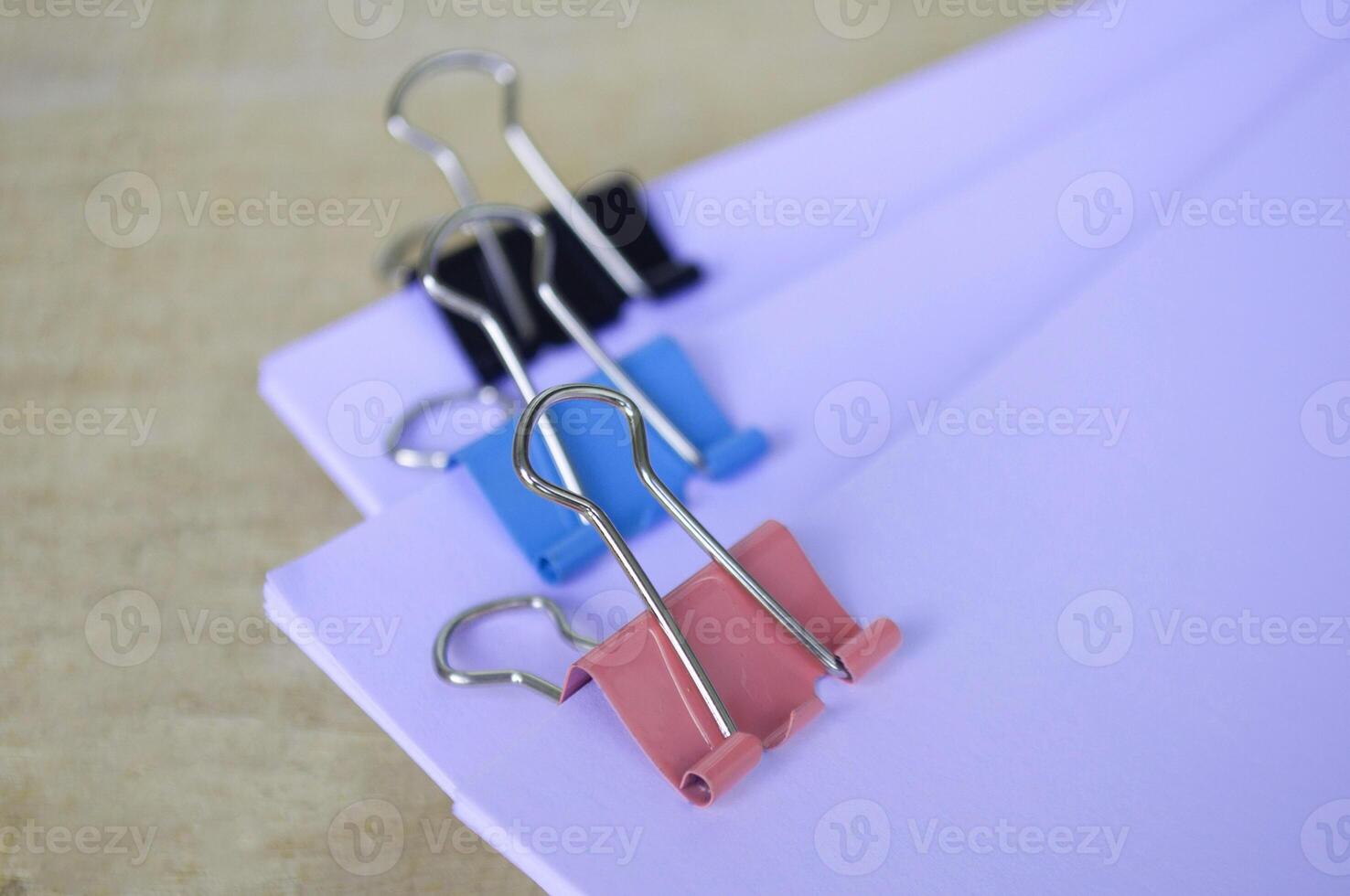 Close up of paper clips pastel clipping blank paper. Documentation concept photo