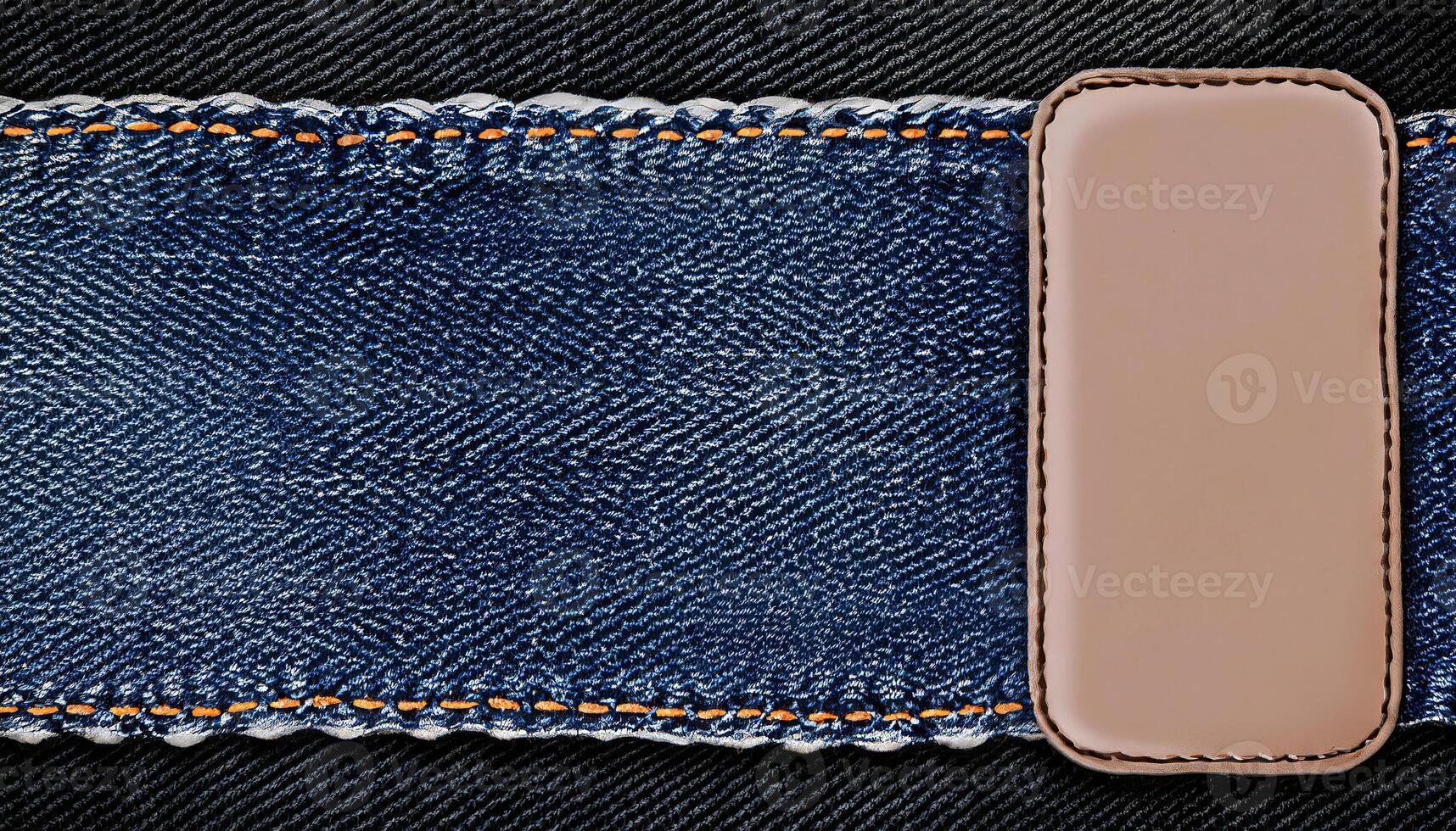 AI generated Black denim background with lace borders and small leather label, a close-up of a denim fabric with a brown leather patch photo