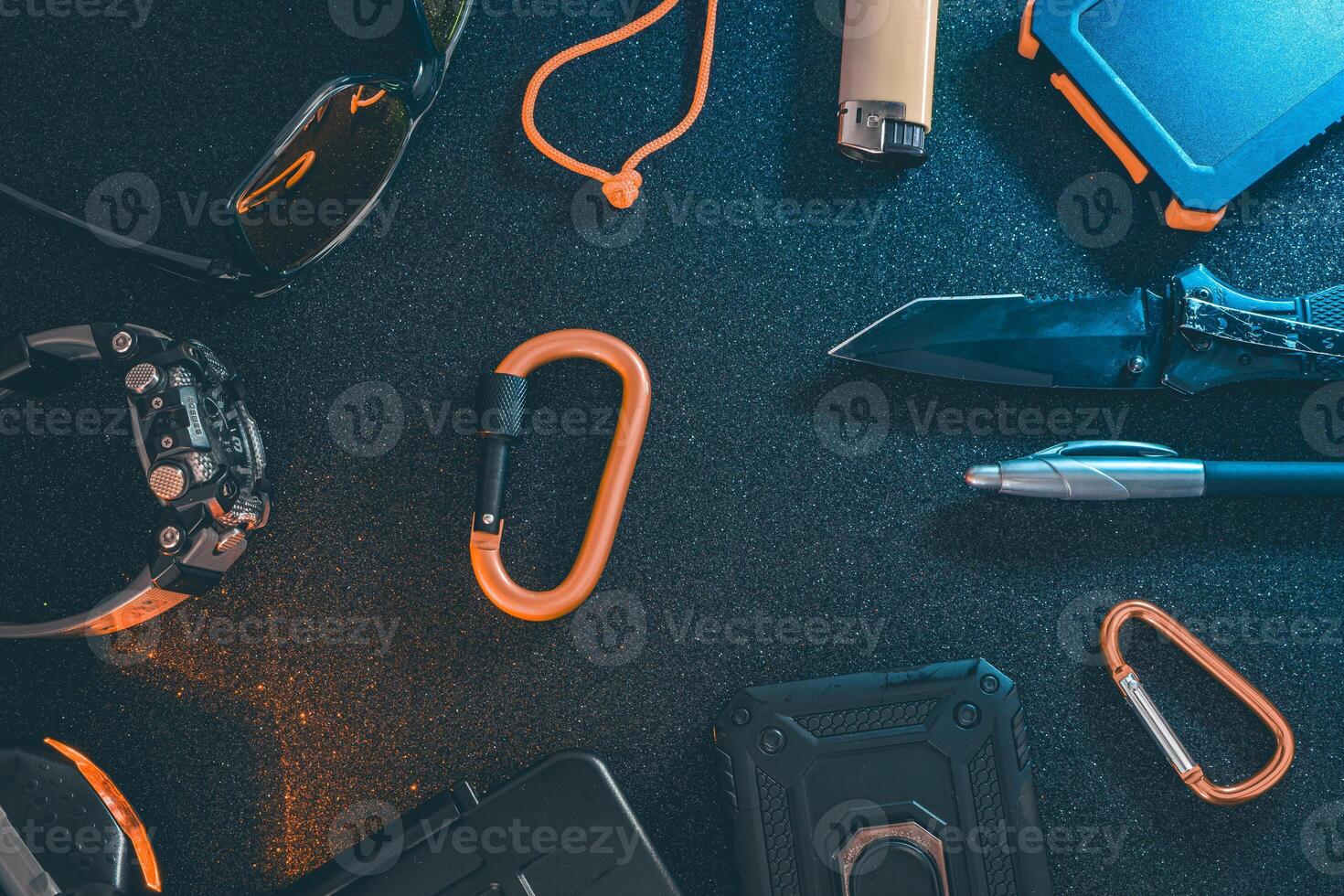 Flat lay of some Outdoor EDC gear on a dark background. photo