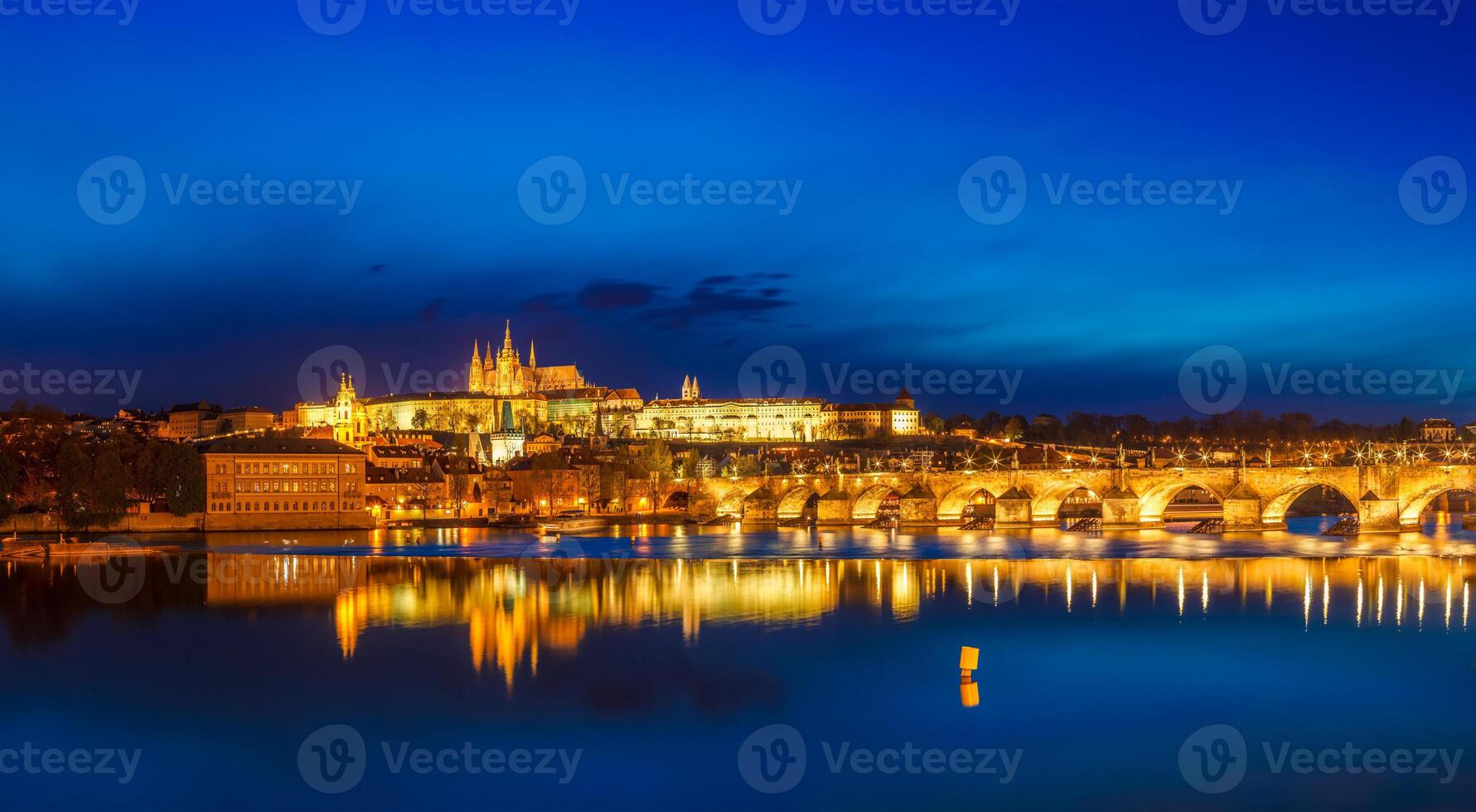 View of Charles Bridge Karluv most and Prague Castle Prazsky hrad in twilight. Panorama photo