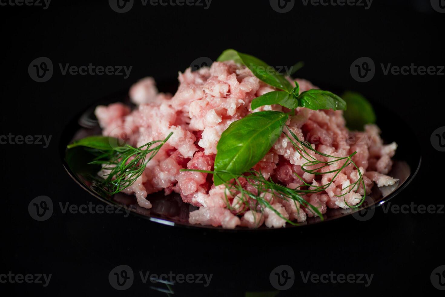 chopped fresh minced pork meat in a plate photo