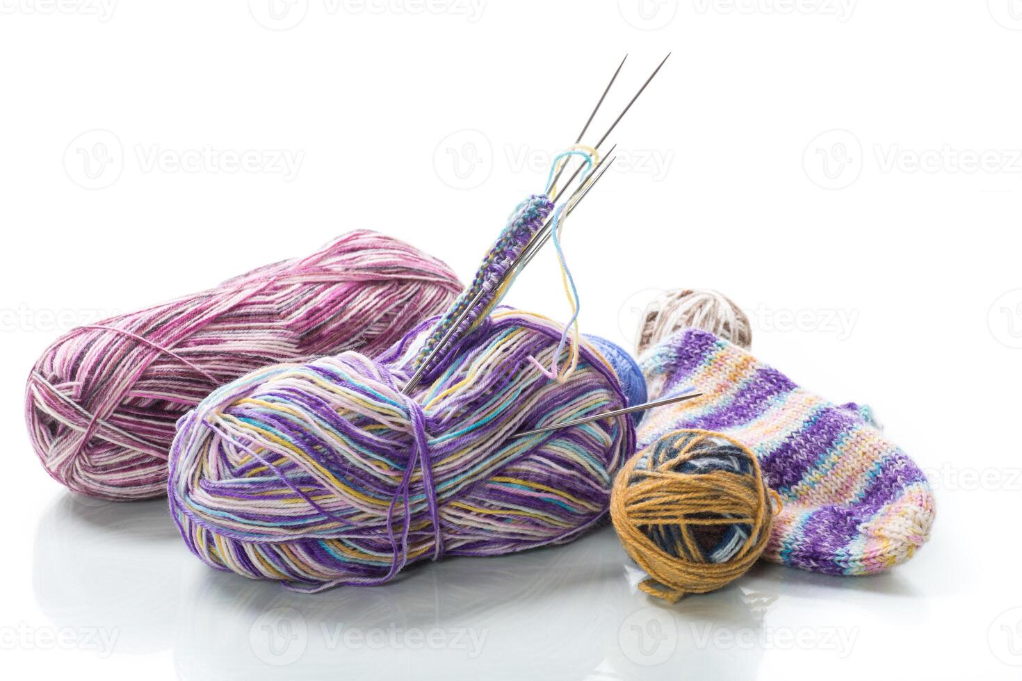 Colored threads, knitting needles and other items for hand knitting photo