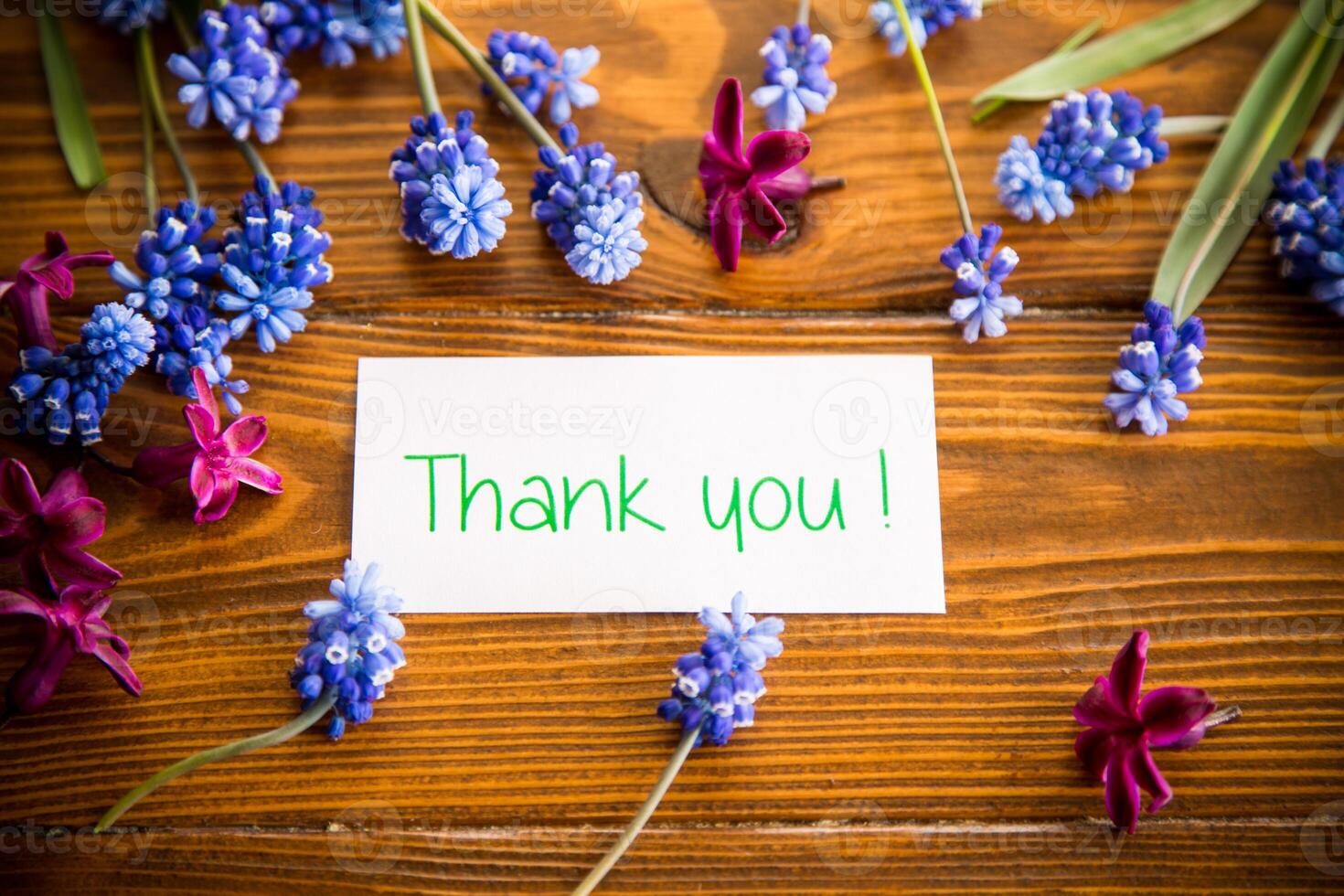 beautiful bouquet of spring flowers on a wooden table photo