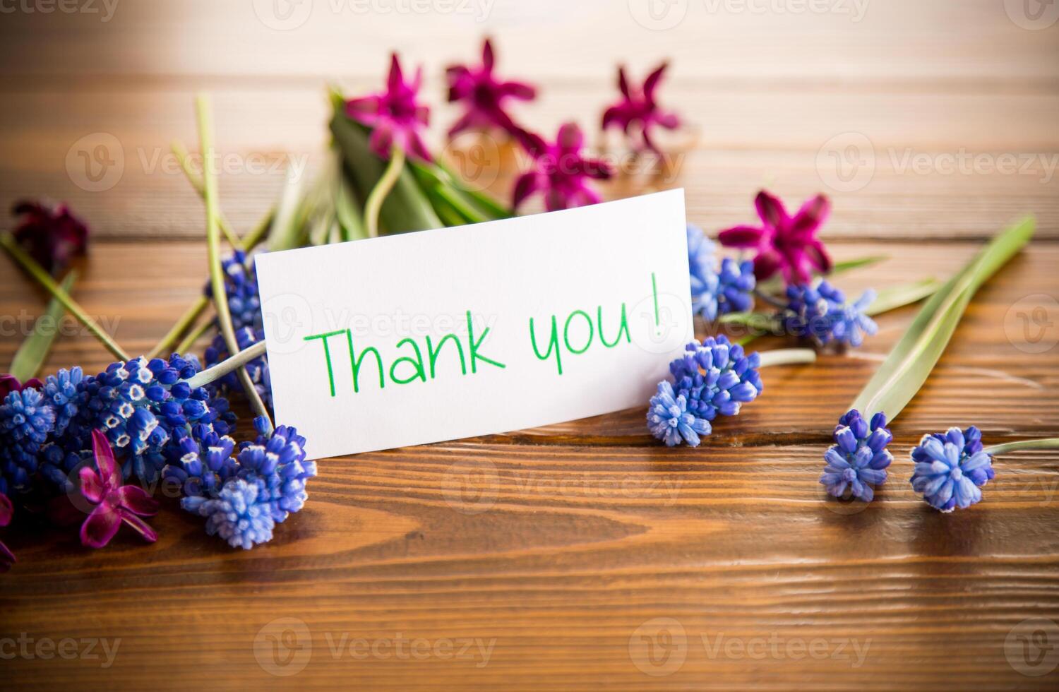 beautiful bouquet of spring flowers on a wooden table photo