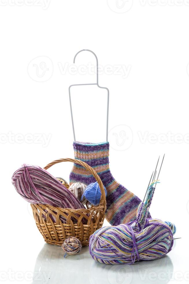 Colored threads, knitting needles and other items for hand knitting photo