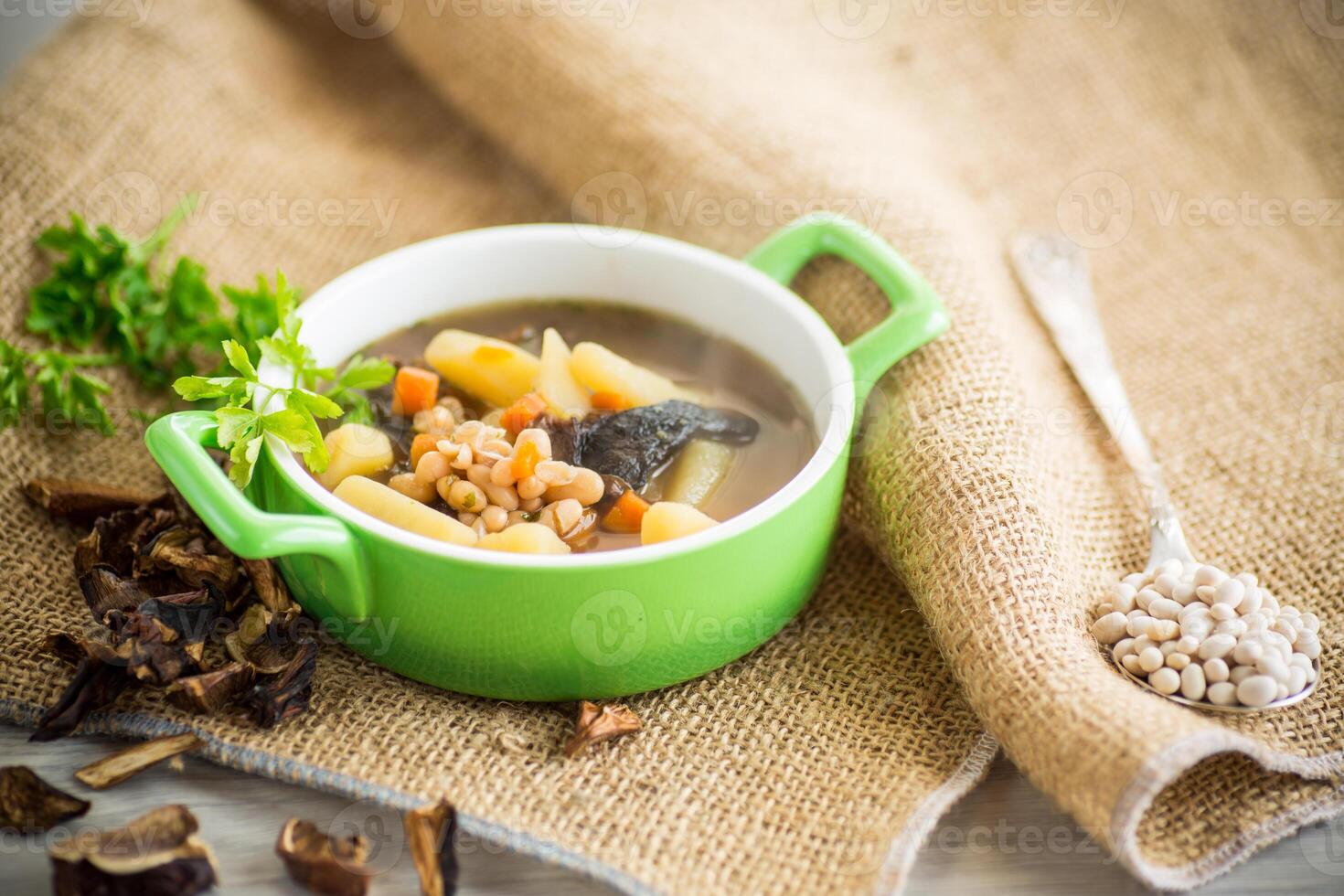 mushroom hot soup with beans in a bowl photo