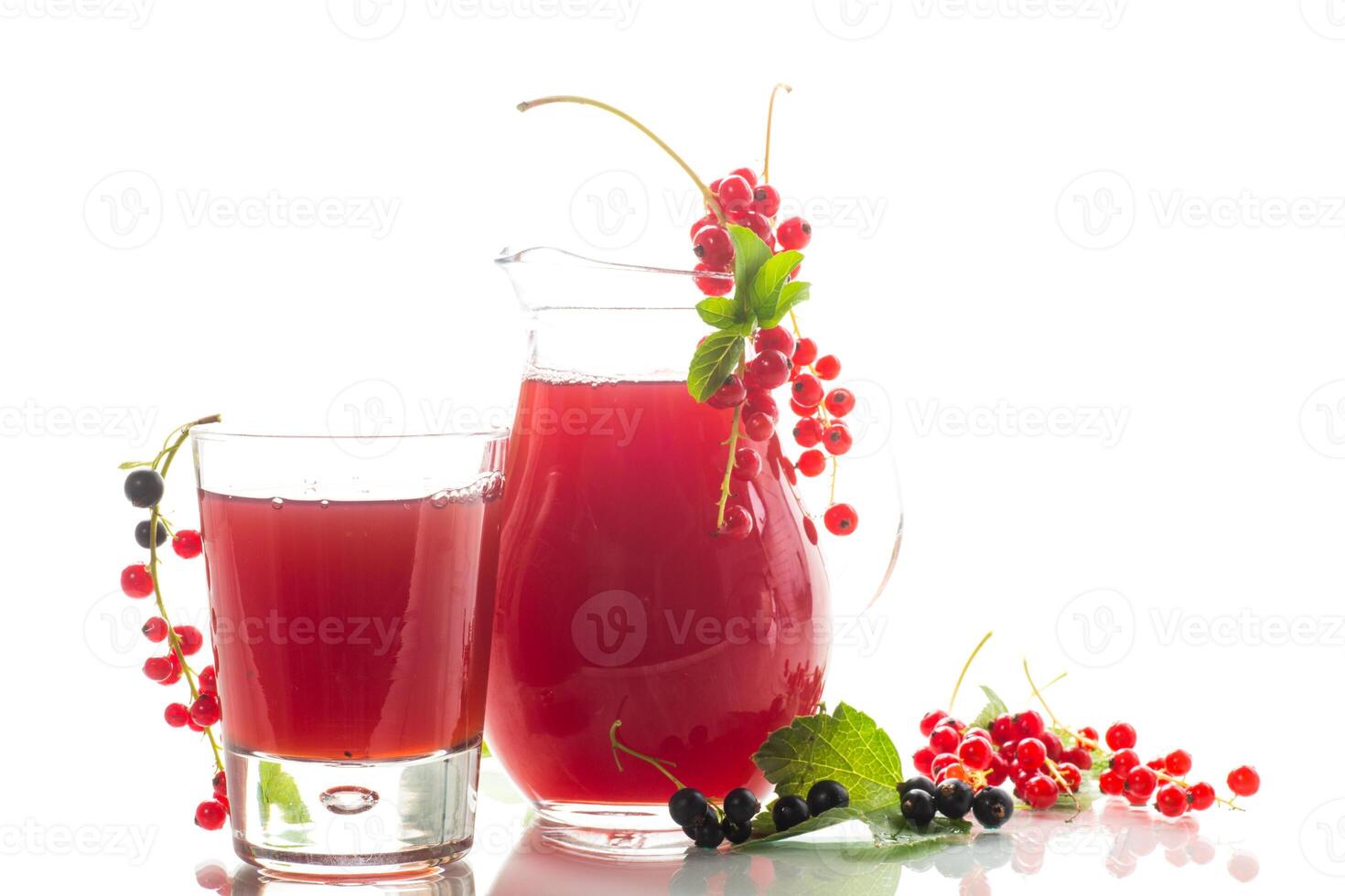 fresh berry juice from red and black currant, on white background photo