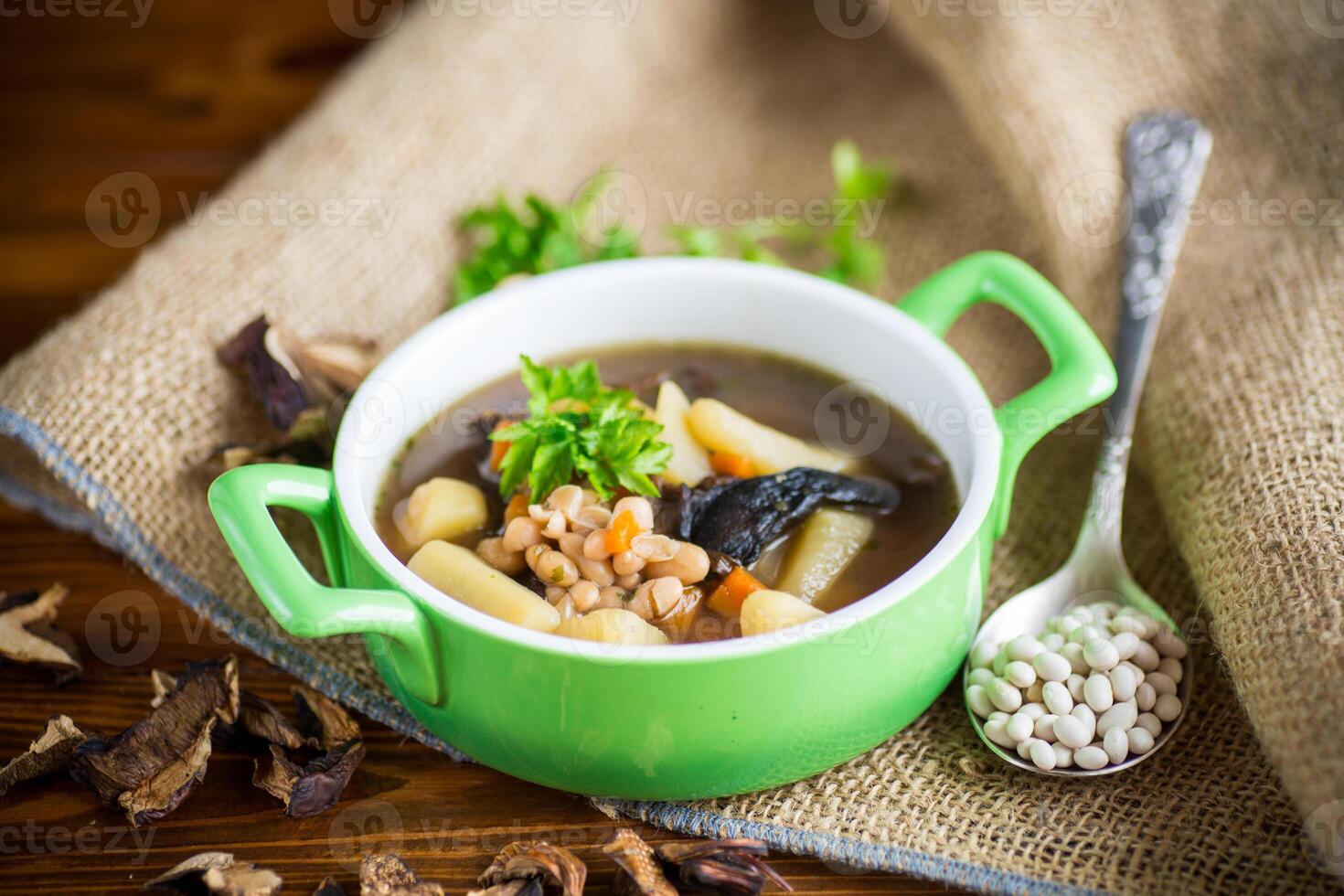 mushroom hot soup with beans in a bowl photo