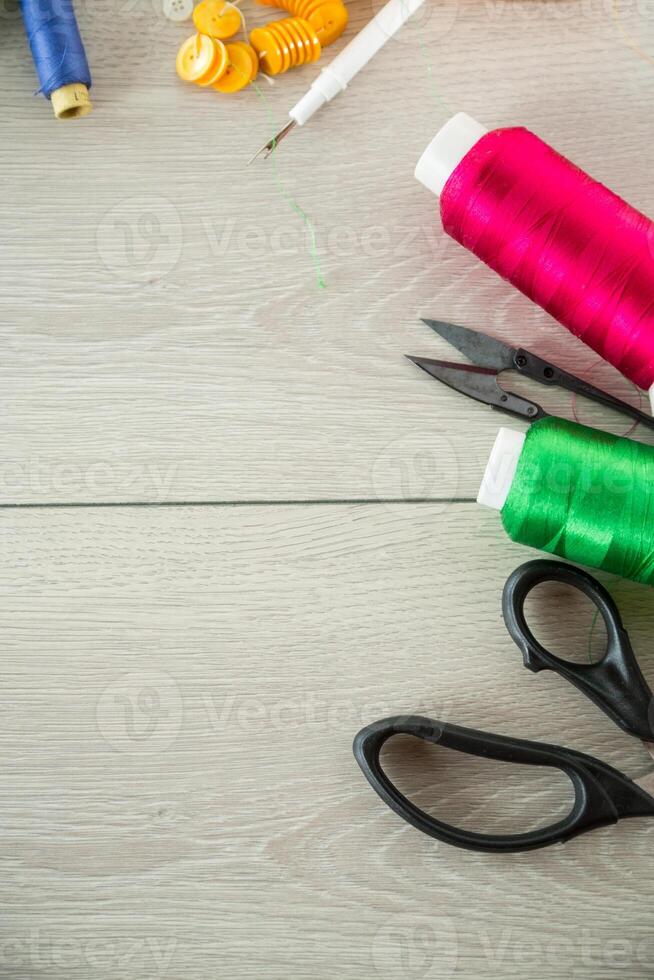 a set of tools and threads for sewing clothes photo