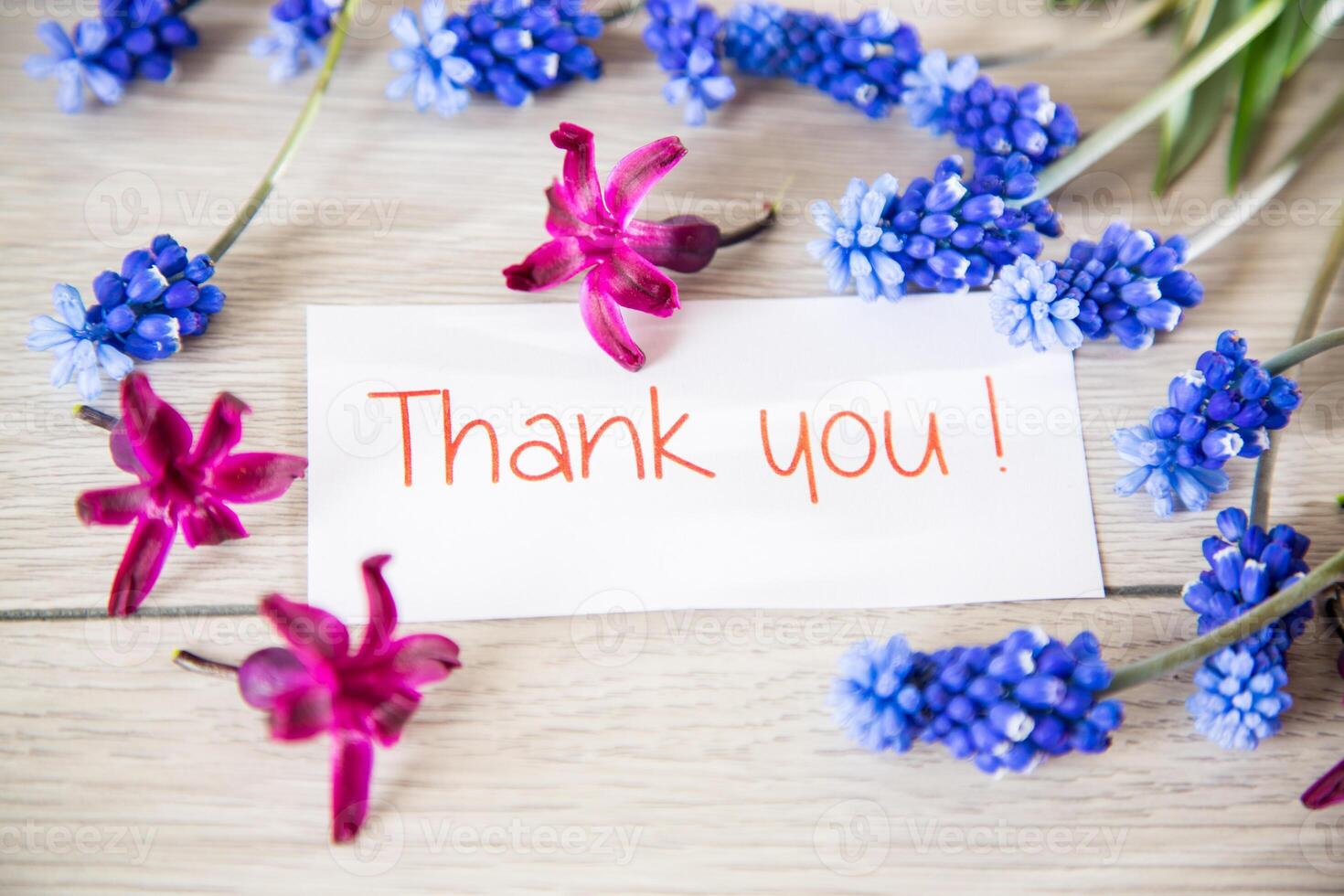 beautiful bouquet of spring flowers on a wooden table photo