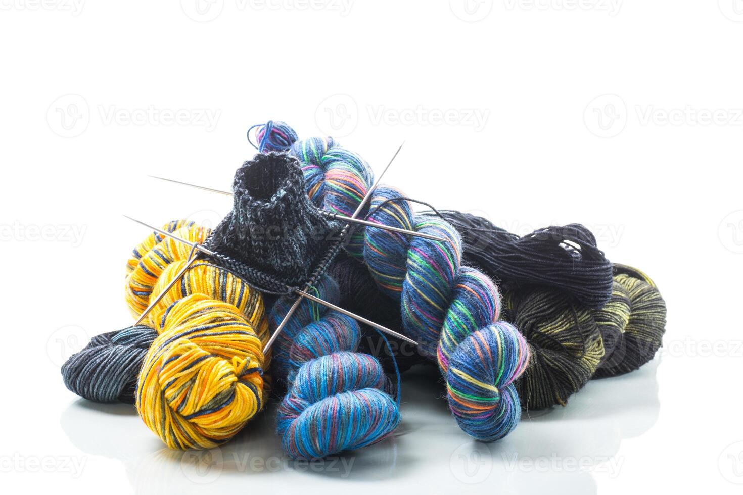 Colored threads, knitting needles and other items for hand knitting photo