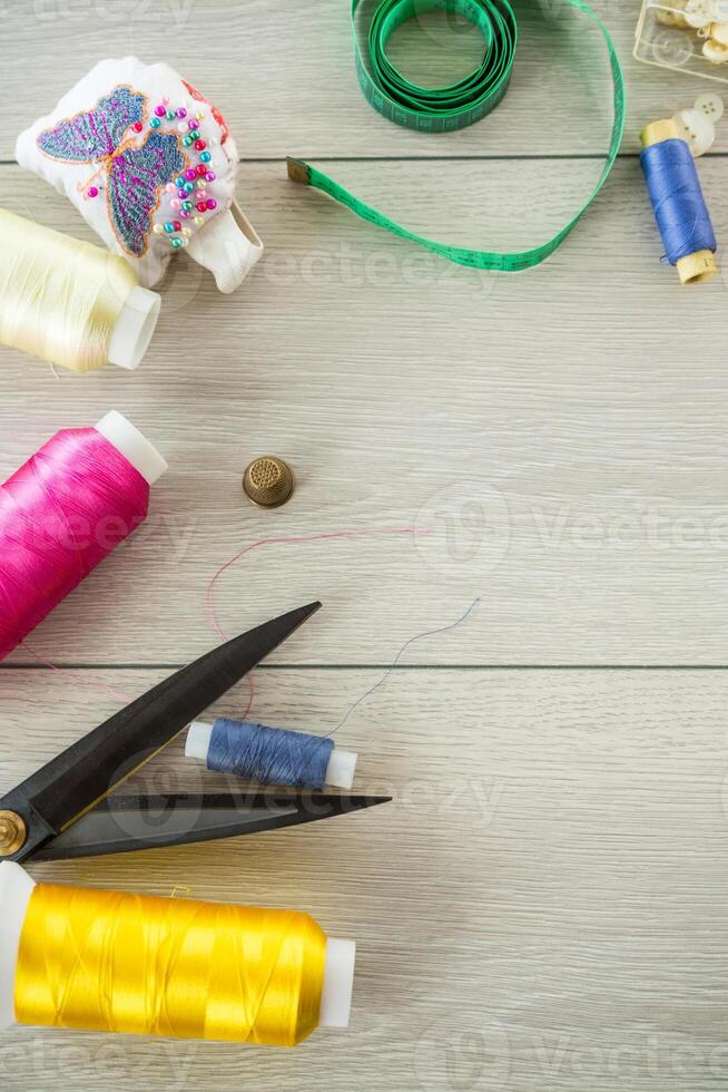 a set of tools and threads for sewing clothes photo