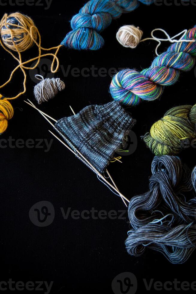 Colored threads, knitting needles and other items for hand knitting photo