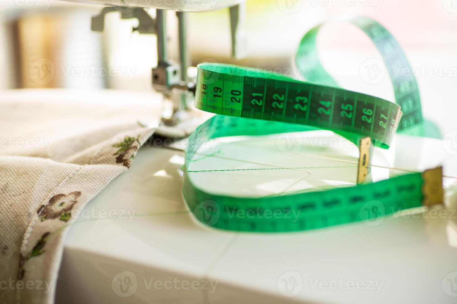 Sewing machine with fabric and threads for sewing, close-up. The working process photo