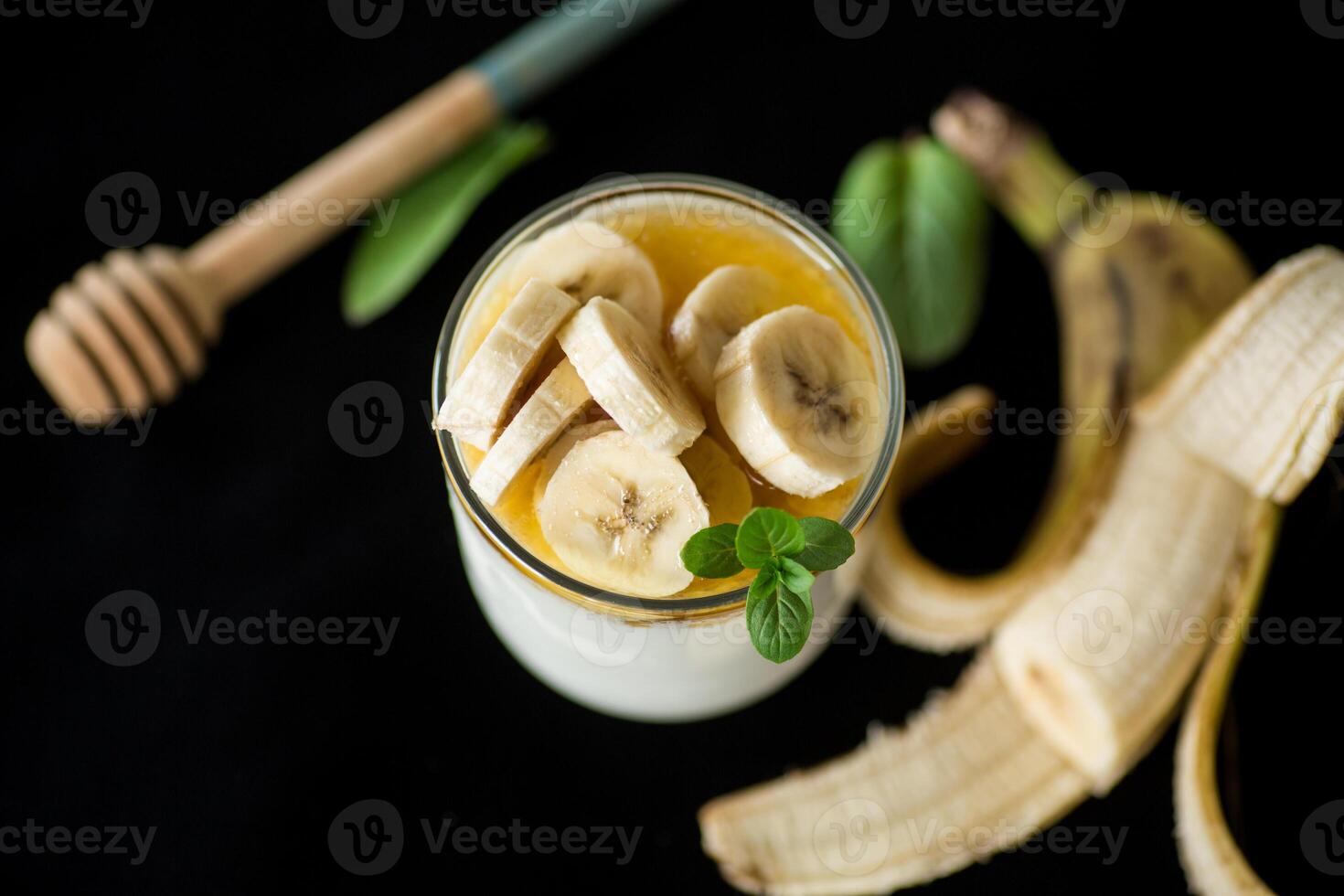 Sweet homemade yogurt with bananas and honey photo