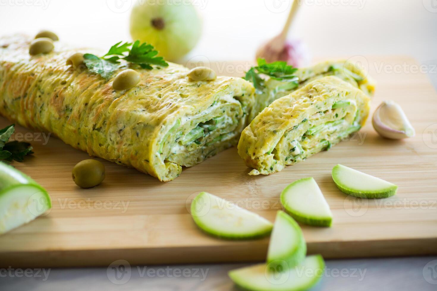 vegetable zucchini roll with garlic cheese filling inside. photo