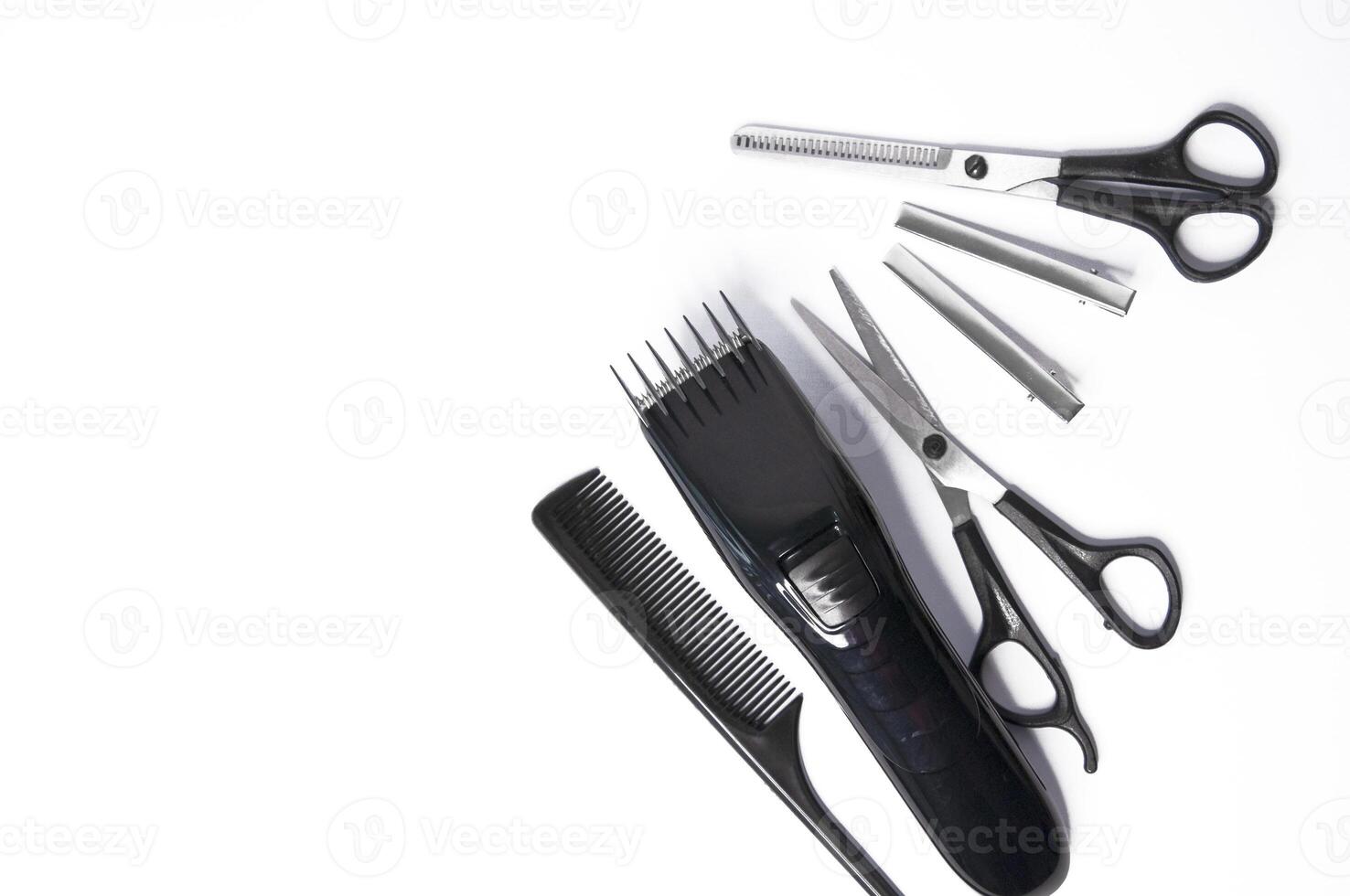 Hairdresser items scissors, comb, clipper on a white background photo