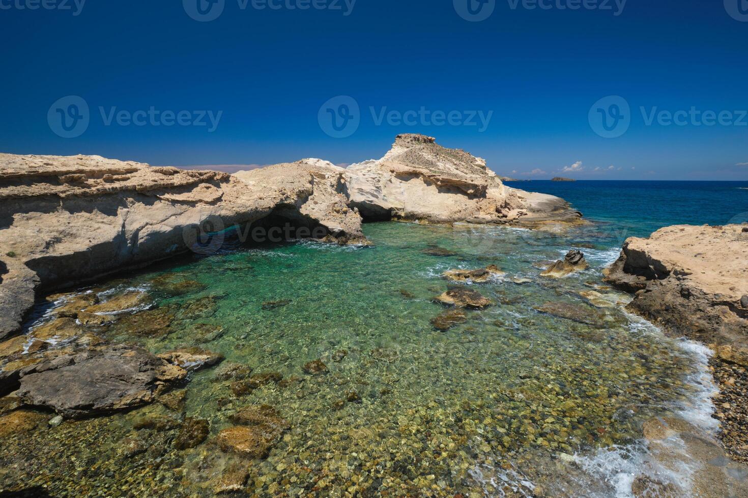 The beach of Agios Konstantinos in Milos, Greece photo