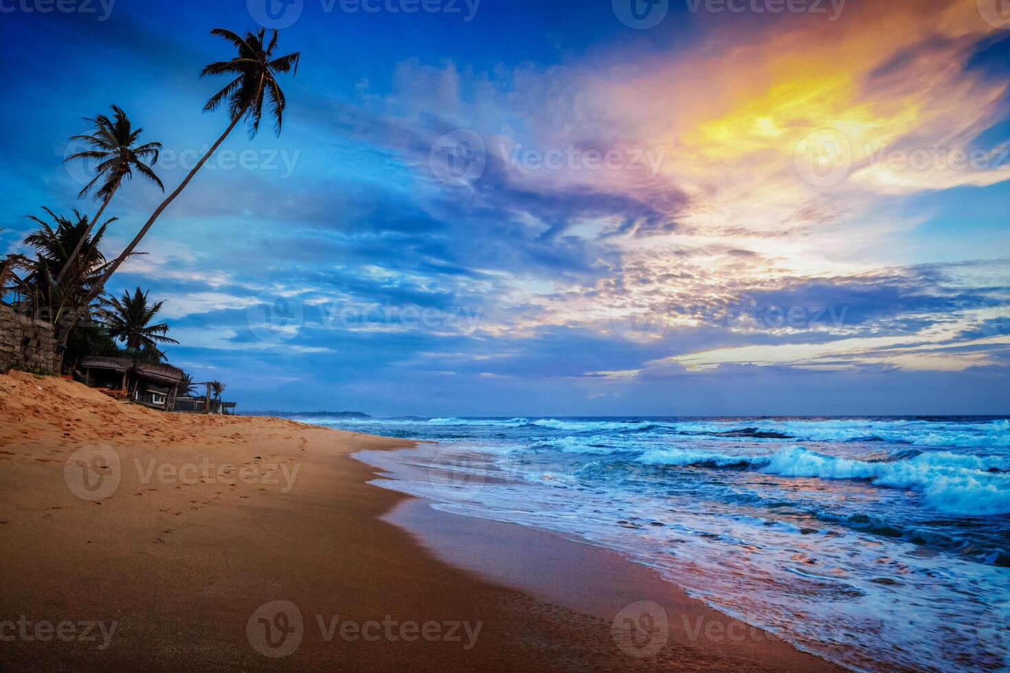 Sunset on tropical beach photo