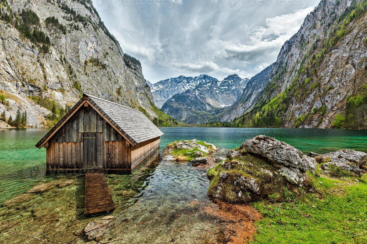 Boat dock on Obersee lake. Bavaria, Germany photo