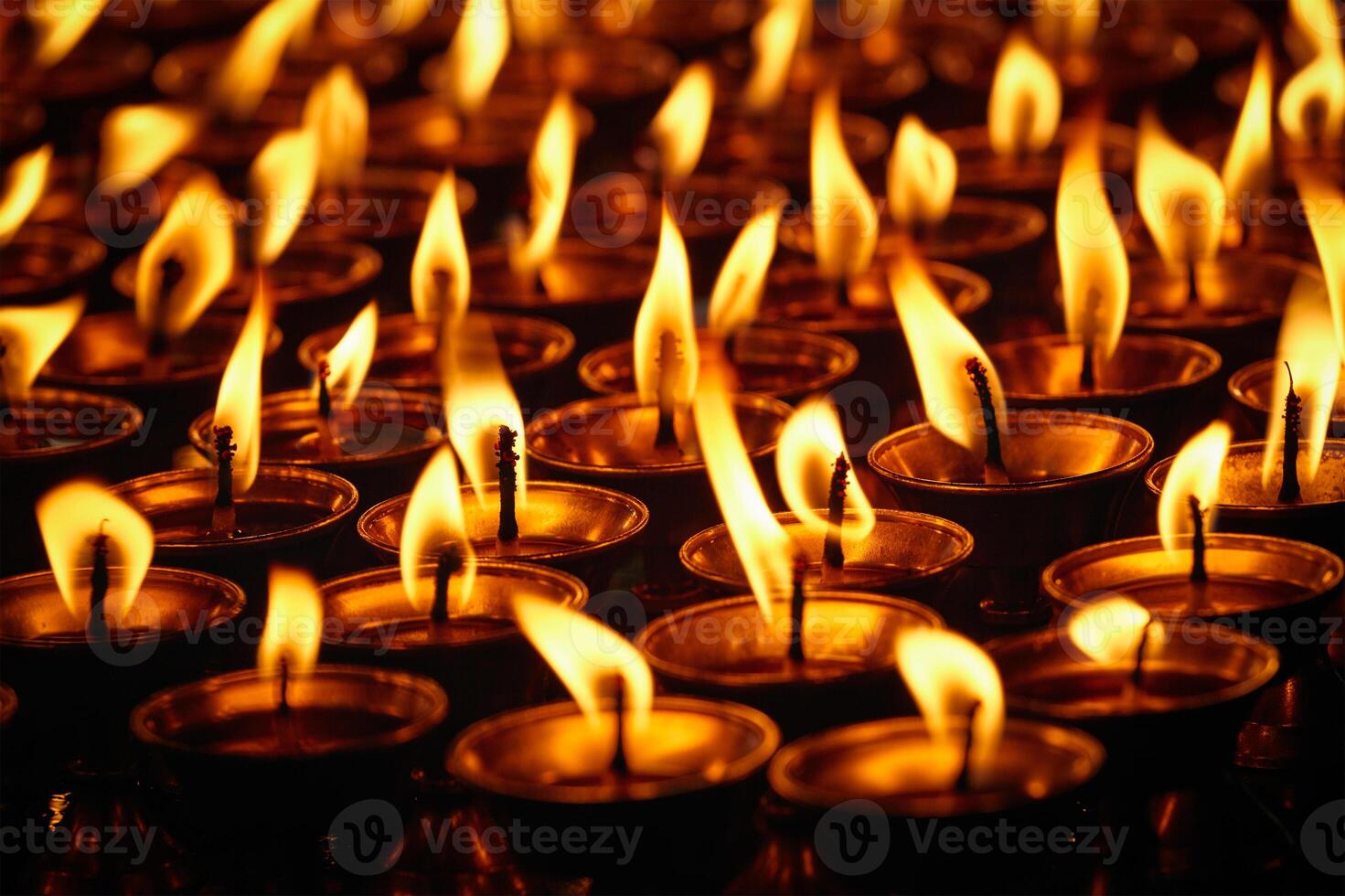 Burning candles in Buddhist temple. Dharamsala, Himachal Pradesh photo
