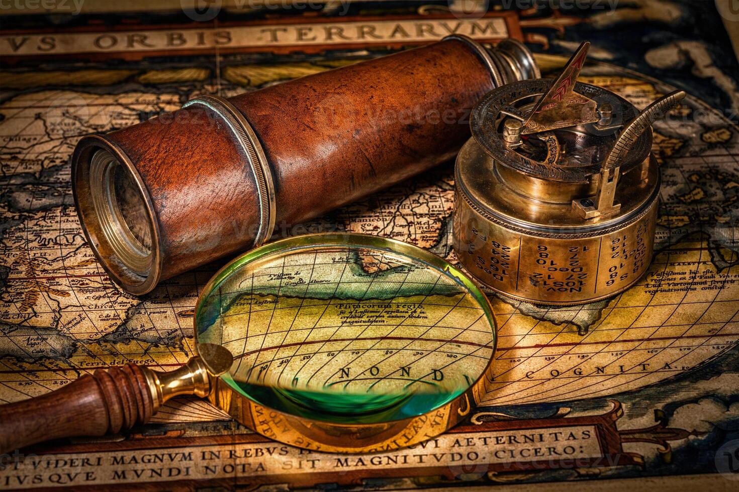 Old vintage compass on ancient map photo