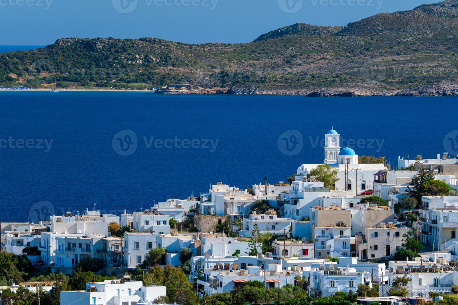 View of Plaka village with traditional Greek church. Milos island, Greece photo