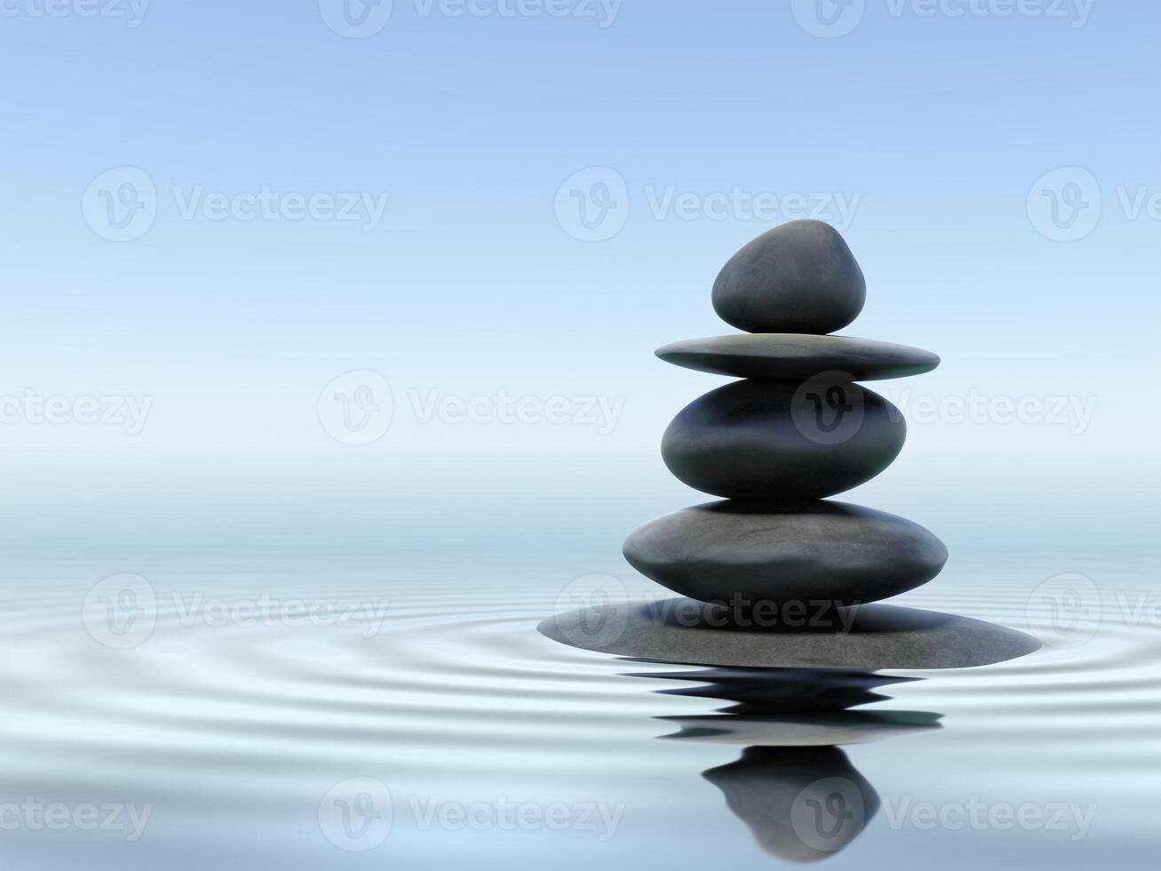 Balanced Zen stones in water with reflection photo