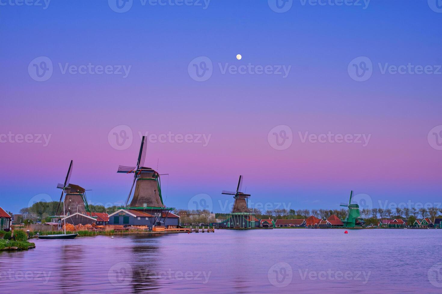 Windmills at Zaanse Schans in Holland in twilight on sunset. Zaa photo