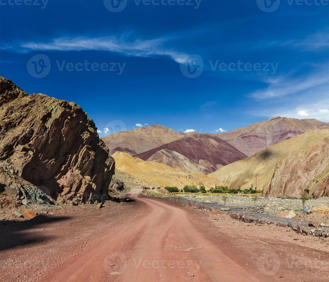 Road in Himalayas with mountains photo