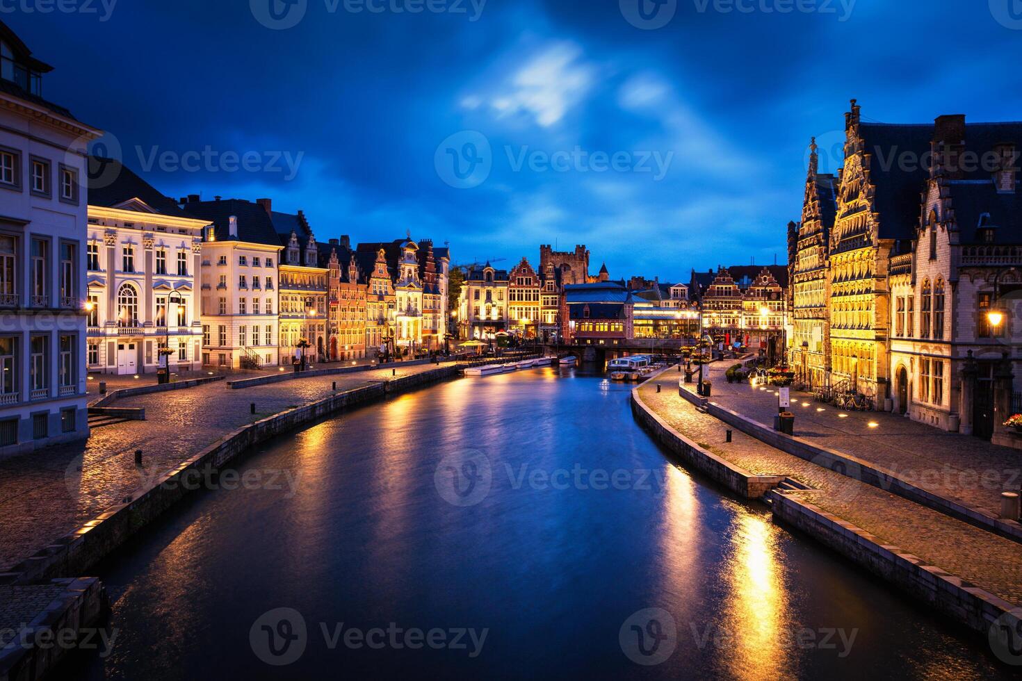 Graslei street and canal in the evening. Ghent, Belgium photo