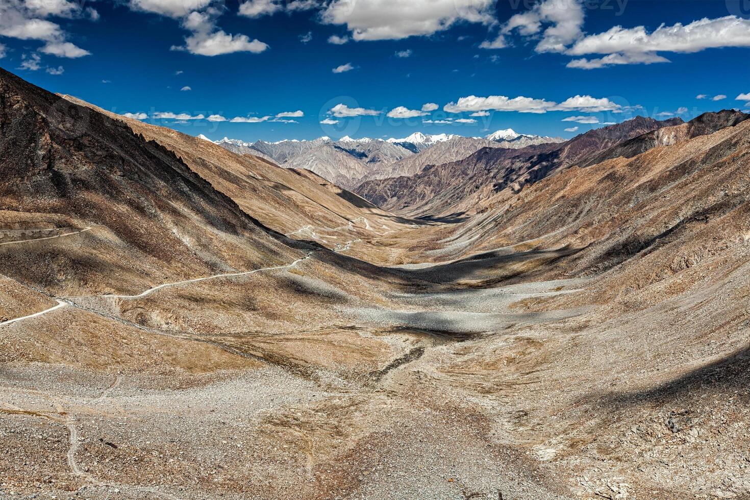 View of Karakoram range and road in valley in Himalayas photo