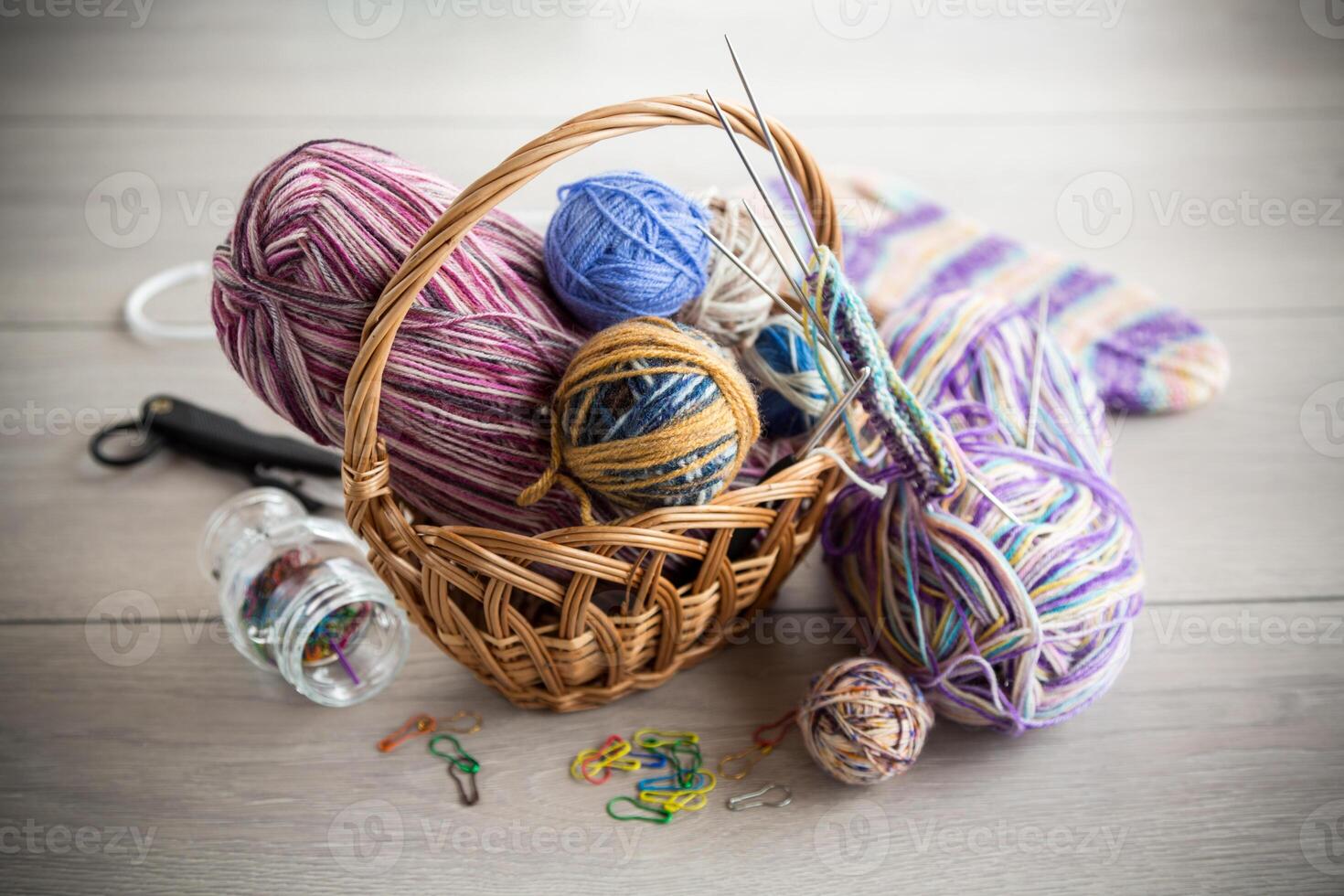 Colored threads, knitting needles and other items for hand knitting photo