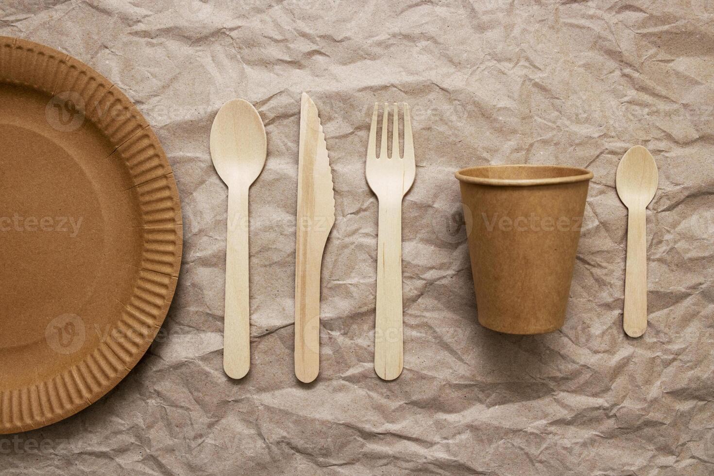 A set of disposable tableware on a paper background photo