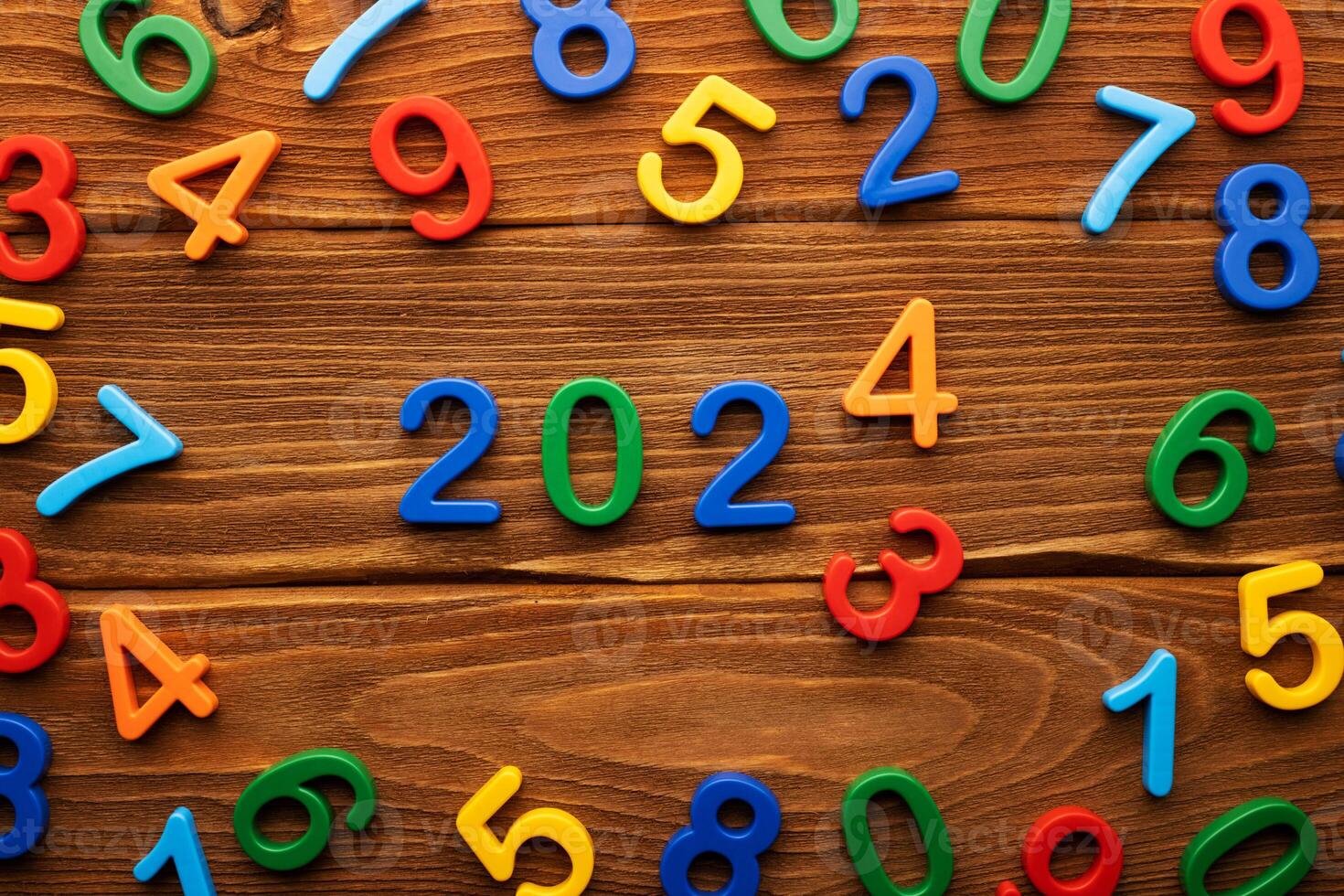 Concept of changing 2023 to 2024 made up of numbers on wooden background photo