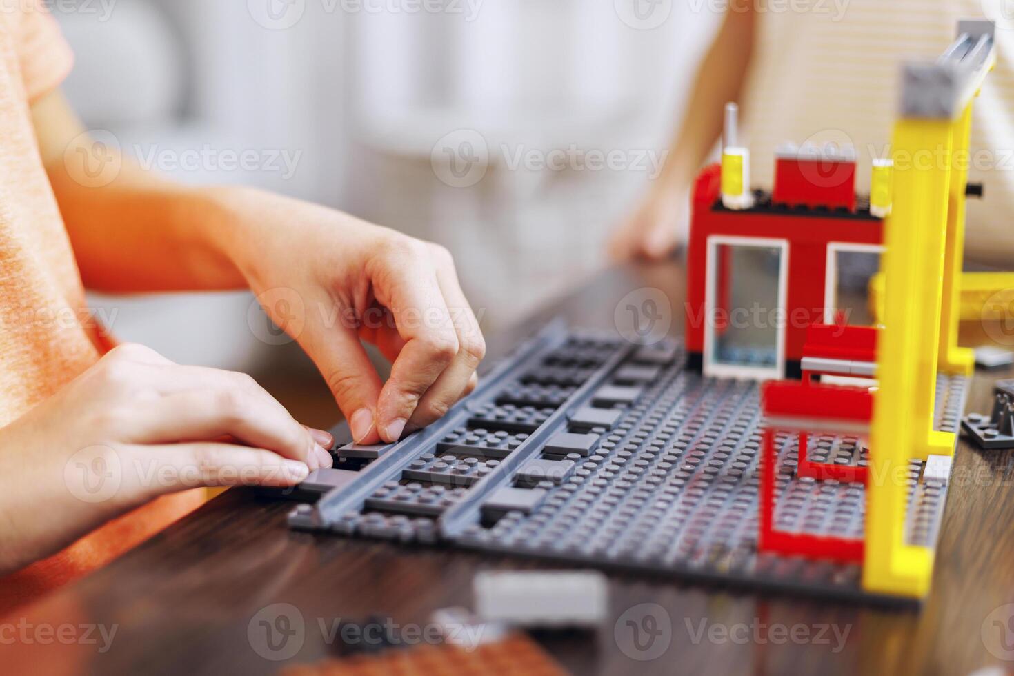 Child Building a Colorful Toy Construction Set photo